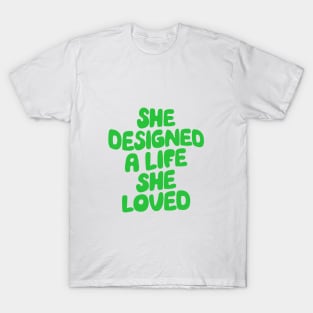 She Designed a Life She Loved by The Motivated Type in Green T-Shirt